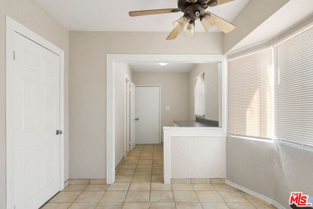 hall with light tile patterned flooring