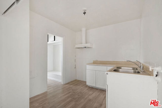 washroom with sink and light wood-type flooring