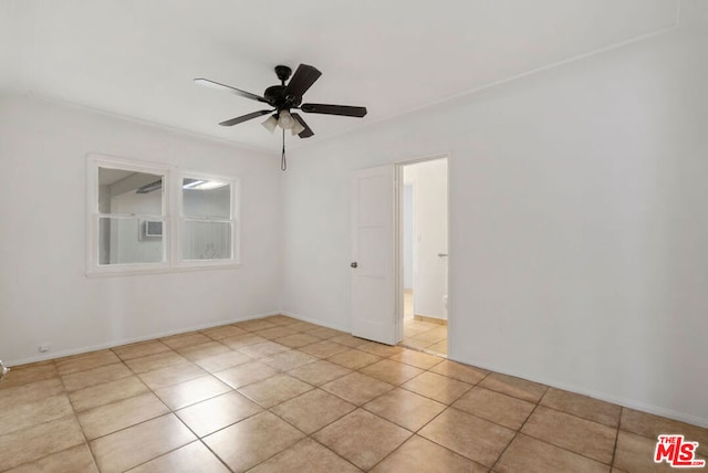 unfurnished room featuring ceiling fan and light tile patterned floors