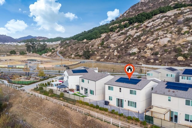 birds eye view of property featuring a mountain view