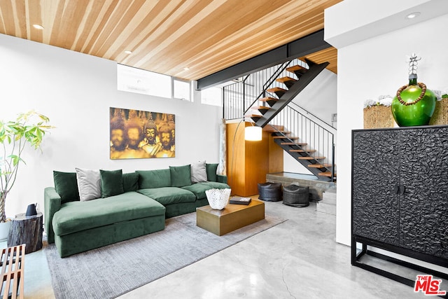 living room with wooden ceiling and concrete floors