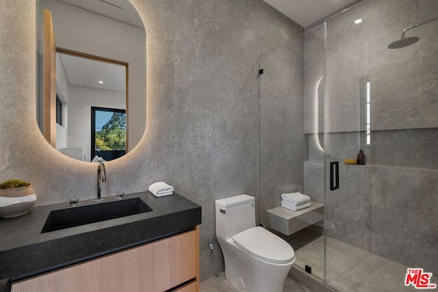 bathroom with vanity, an enclosed shower, and toilet