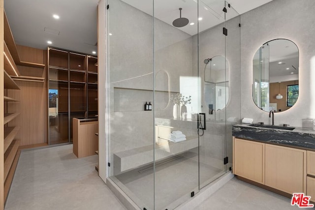 bathroom featuring vanity and walk in shower