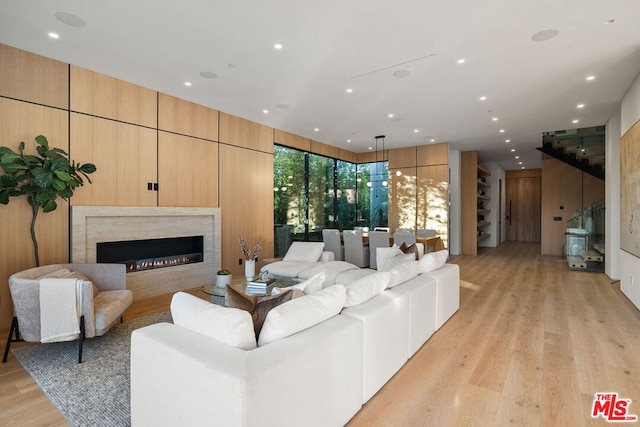 living room featuring a fireplace and light hardwood / wood-style flooring