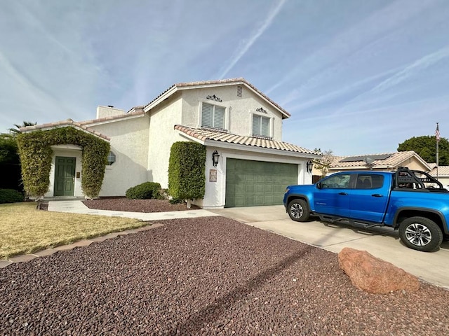 mediterranean / spanish-style house featuring a garage