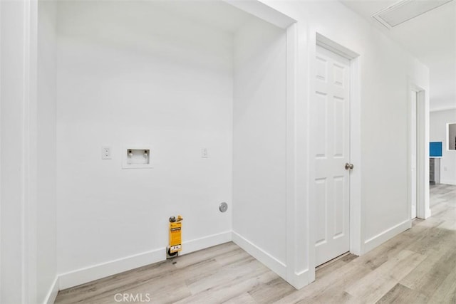 laundry area featuring light hardwood / wood-style floors