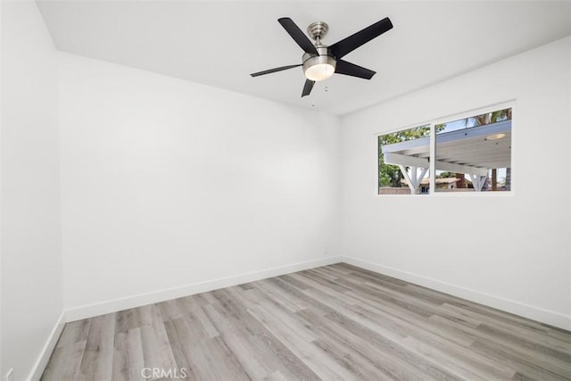 spare room with ceiling fan and light hardwood / wood-style floors