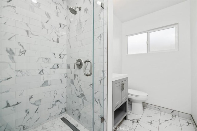 bathroom featuring vanity, toilet, and walk in shower