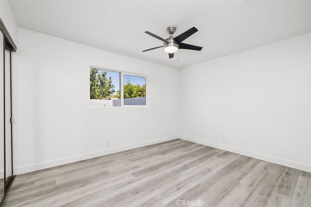 unfurnished room featuring ceiling fan and light hardwood / wood-style floors