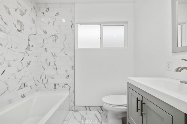 full bathroom featuring vanity, tiled shower / bath, and toilet