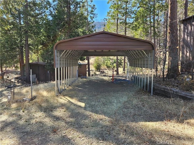 view of parking / parking lot featuring a carport