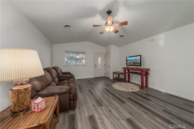 living room with ceiling fan, lofted ceiling, and dark wood-type flooring