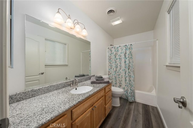 full bathroom featuring shower / bathtub combination with curtain, vanity, wood-type flooring, and toilet