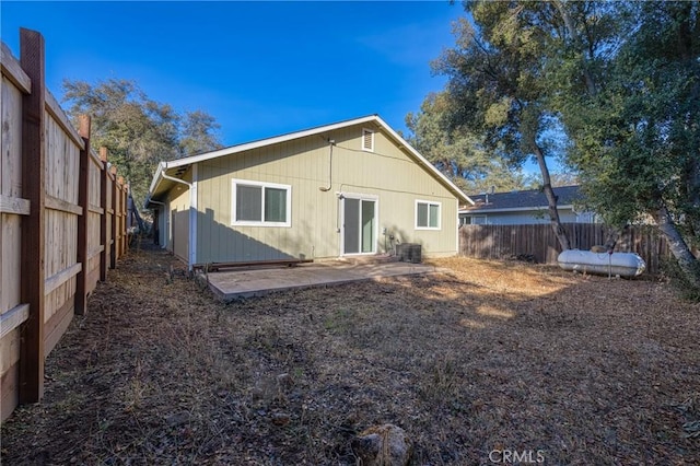 back of house featuring central AC unit and a patio area