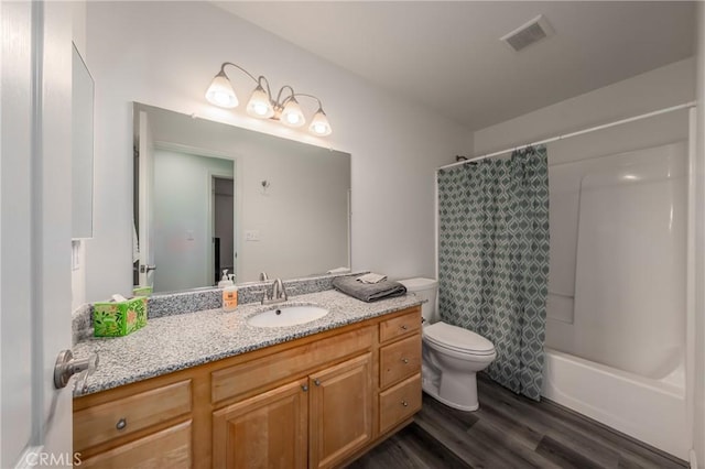 full bathroom featuring wood-type flooring, vanity, toilet, and shower / bathtub combination with curtain