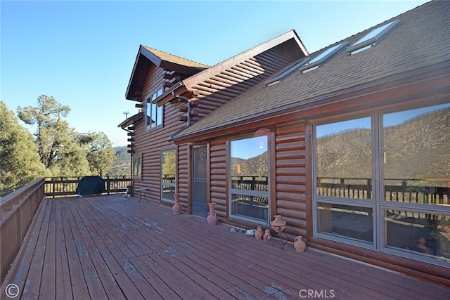 wooden deck featuring a mountain view