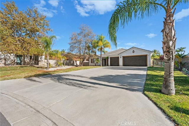 ranch-style house featuring a garage and a front lawn