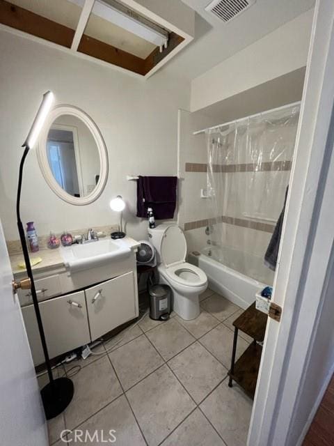 full bathroom featuring tile patterned flooring, vanity, shower / bath combination with curtain, and toilet