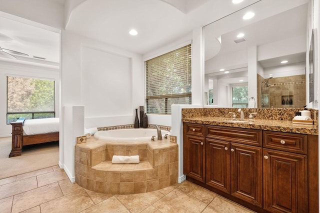 bathroom with tile patterned flooring, vanity, separate shower and tub, and ceiling fan