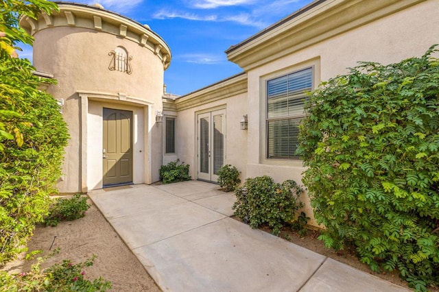 doorway to property featuring french doors