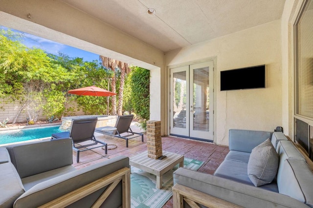 view of patio with french doors and an outdoor hangout area