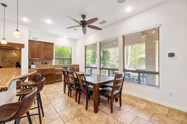 dining area featuring ceiling fan and a healthy amount of sunlight