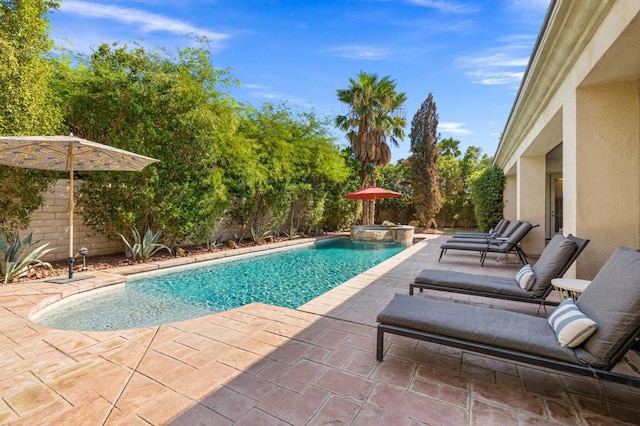 view of pool featuring an in ground hot tub and a patio