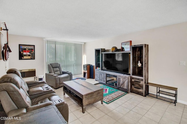 tiled living room with a textured ceiling and a wall unit AC