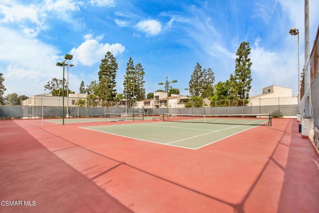 view of sport court featuring basketball hoop