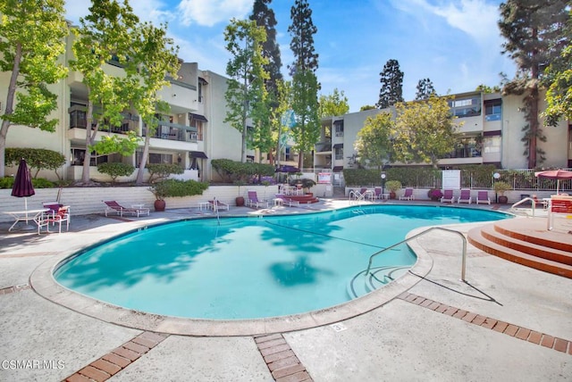 view of swimming pool featuring a patio area