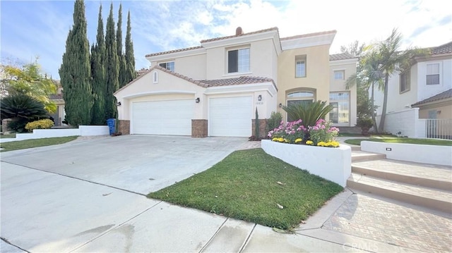 mediterranean / spanish-style home with a garage