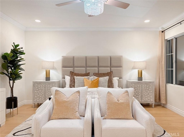 bedroom featuring light wood-type flooring, ceiling fan, and ornamental molding