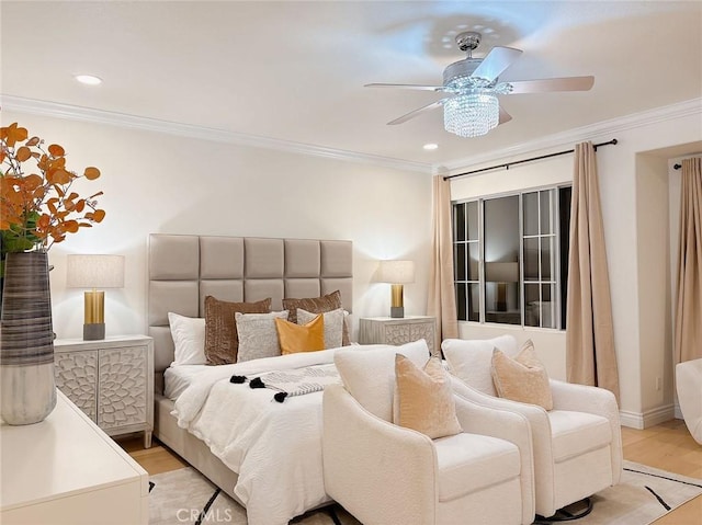 bedroom with light hardwood / wood-style floors, ceiling fan, and ornamental molding