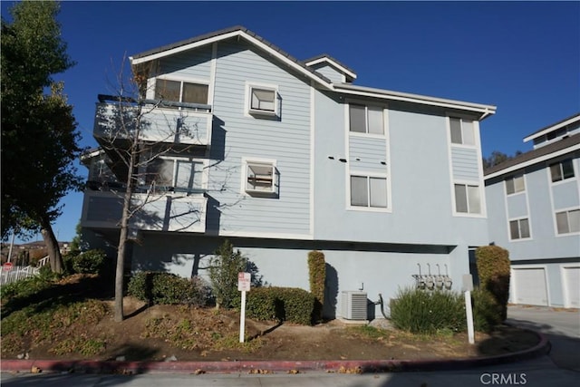 view of front facade featuring cooling unit