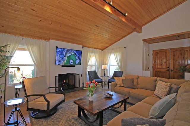 living room featuring lofted ceiling with beams, wood ceiling, and rail lighting