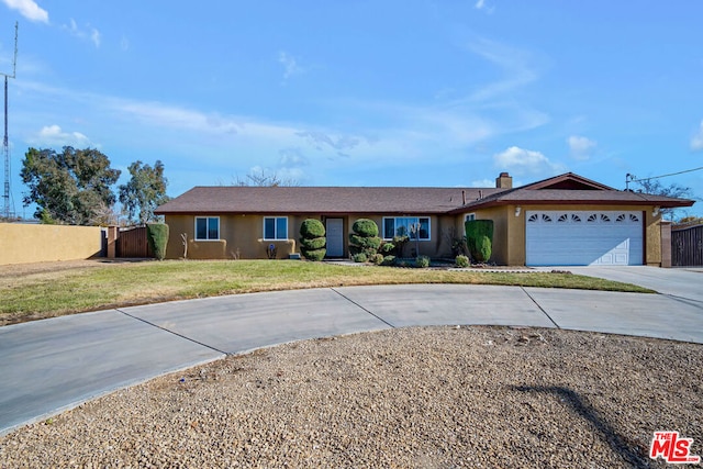 ranch-style house with a front lawn and a garage