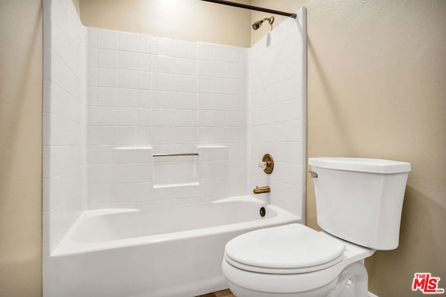 bathroom featuring toilet and tub / shower combination