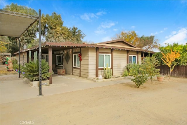 rear view of house featuring a patio