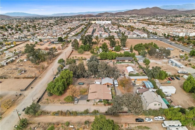 birds eye view of property with a mountain view