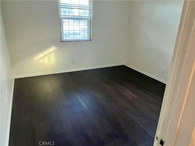 empty room featuring dark hardwood / wood-style floors