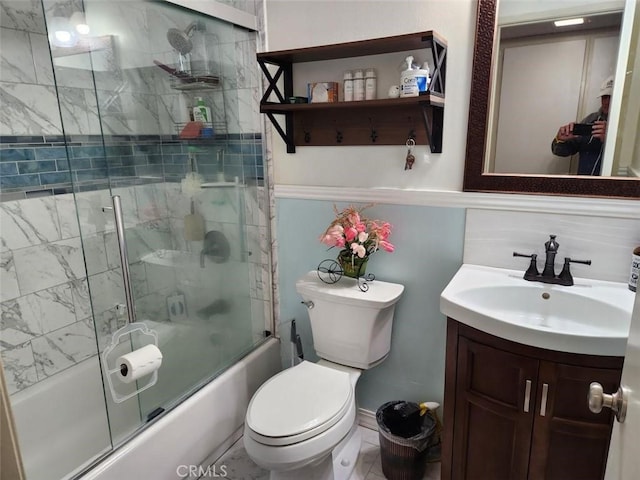 full bathroom with vanity, toilet, and enclosed tub / shower combo