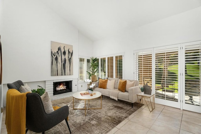 living room with light tile patterned flooring and high vaulted ceiling