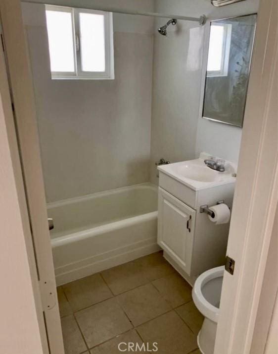 full bathroom with toilet, tile patterned flooring, washtub / shower combination, and vanity