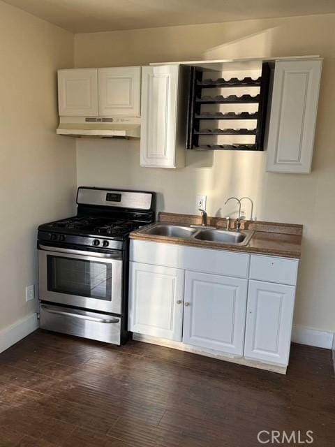 kitchen featuring sink, white cabinets, and stainless steel gas range oven