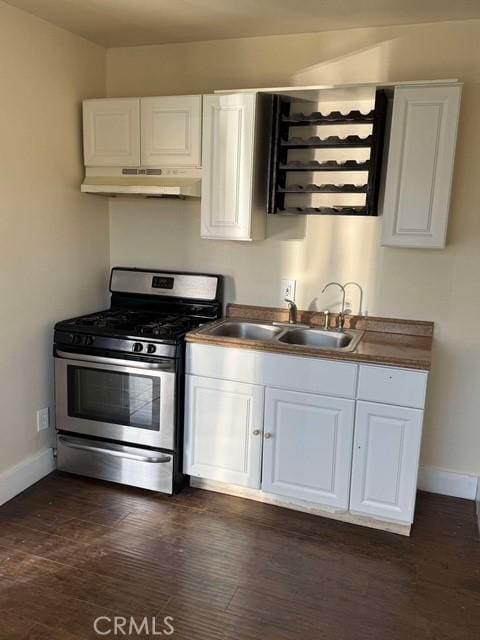 kitchen featuring white cabinets, sink, and stainless steel range with gas stovetop