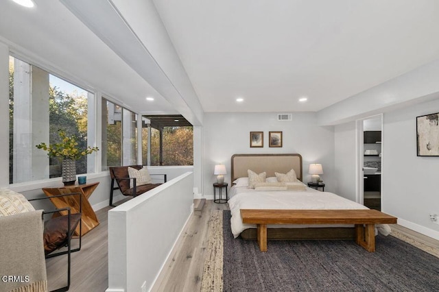 bedroom featuring recessed lighting, visible vents, baseboards, and wood finished floors