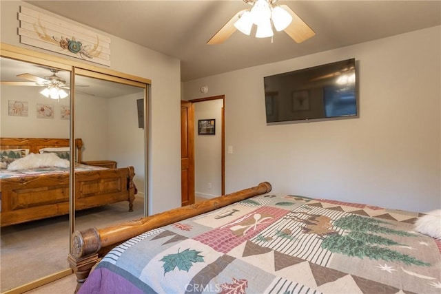 bedroom with ceiling fan, a closet, and carpet floors