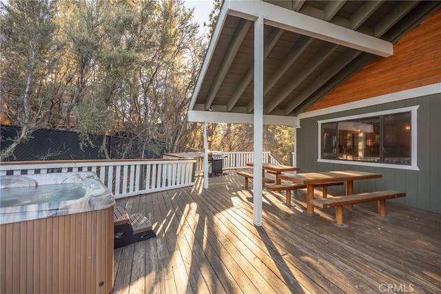 wooden terrace featuring area for grilling and a hot tub