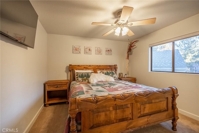 bedroom with ceiling fan and dark carpet