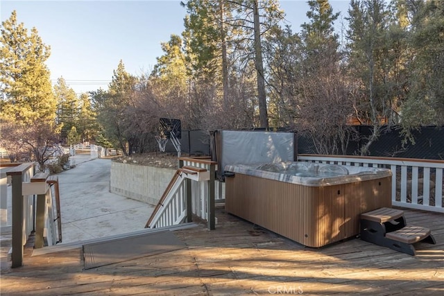 wooden terrace with a hot tub